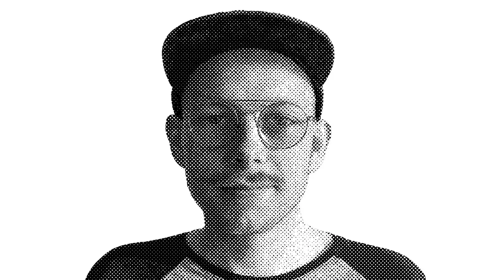 A black and white photo of a man with glasses.
